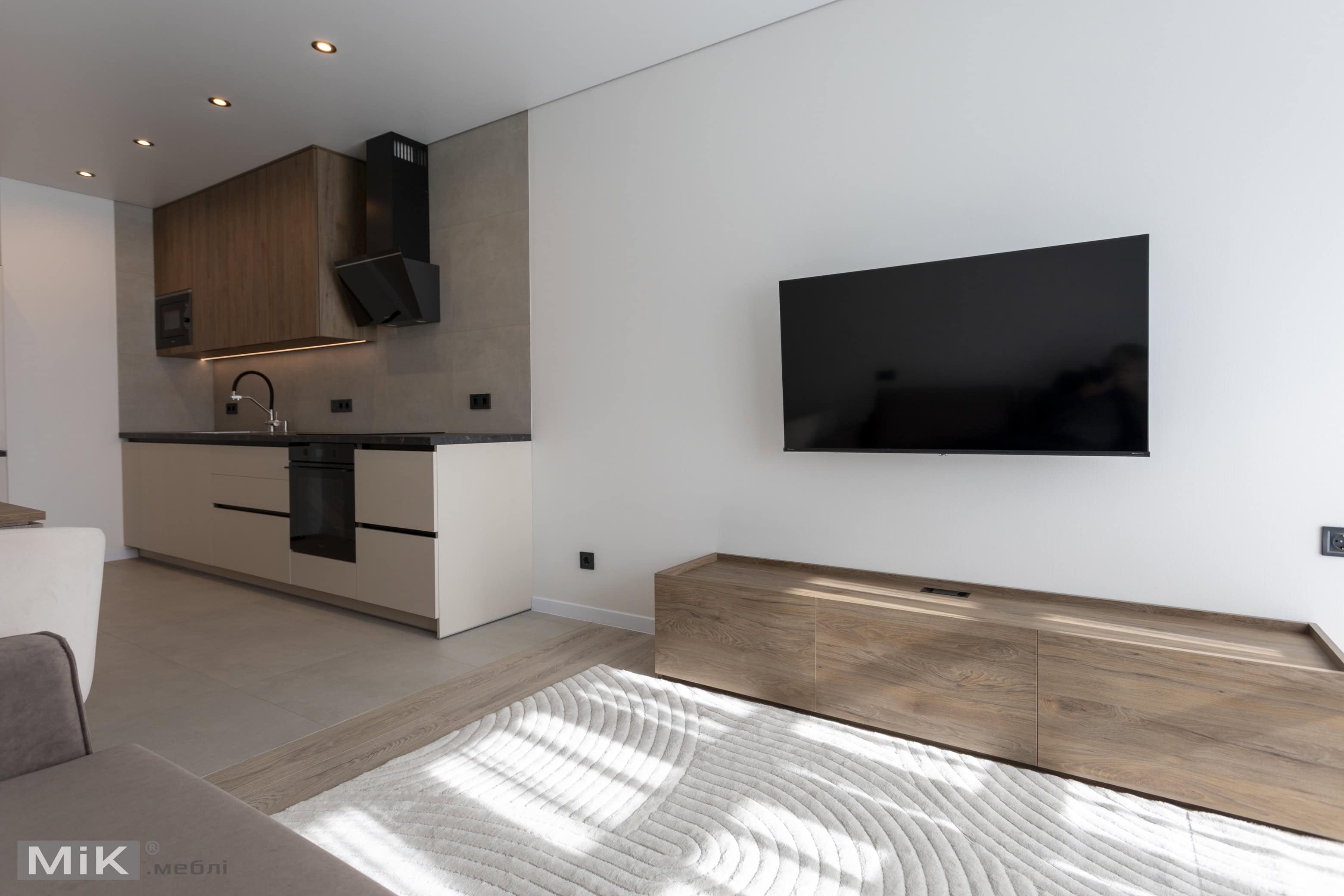 9_pidvisna-tumba-pid-tv-u-kvartyri Кухня и ТВ-зона в квартире в едином стиле на заказ